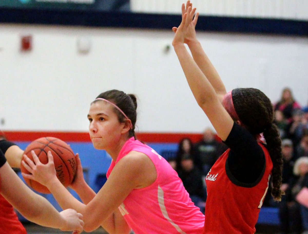 Junior Kiana Starstead looks for a pass during the Hoops for Hope home game played in the Spartan main gym. She is on the girls varsity basketball team where she puts in 100% dedication. 