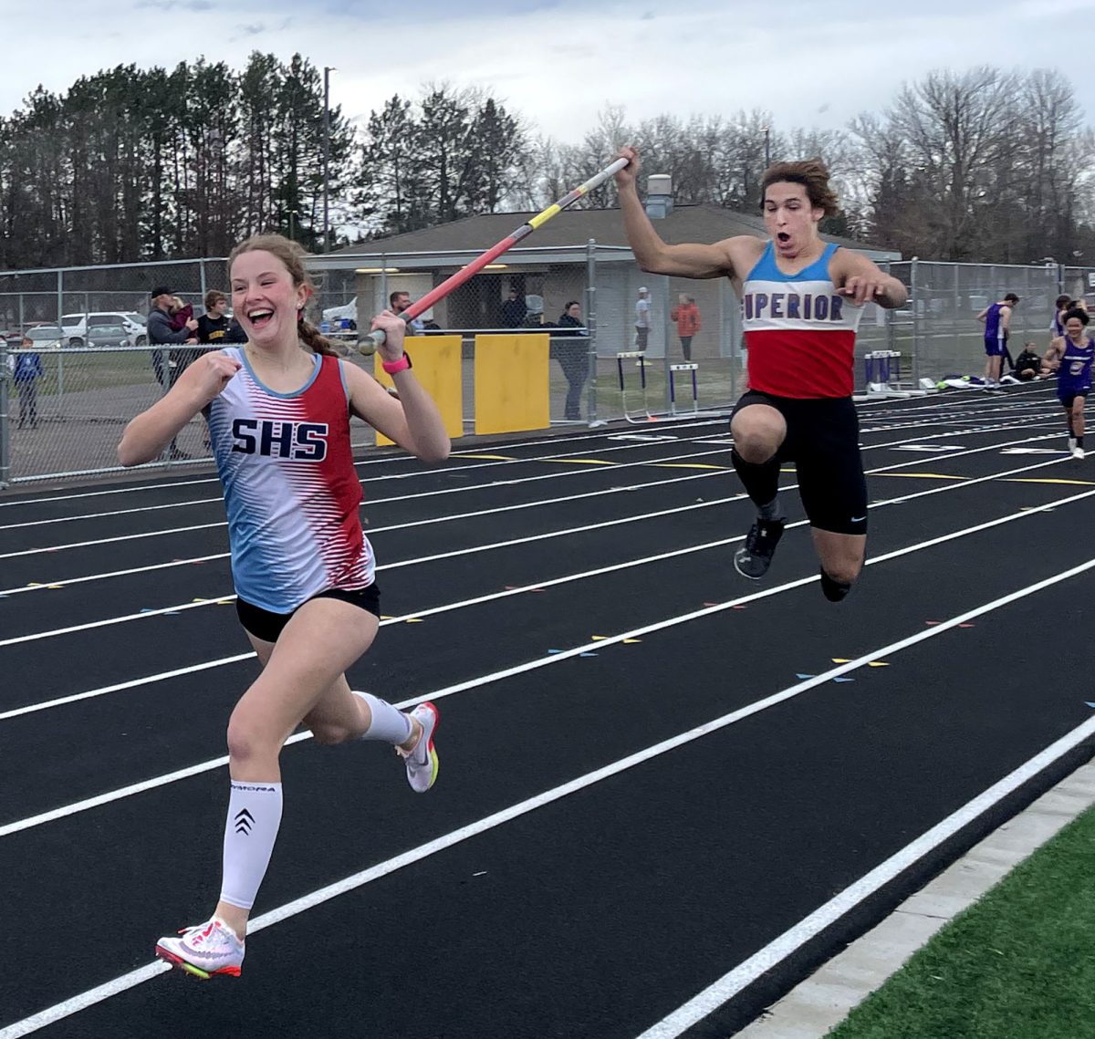 Captain Micky Little (right) recreates a Jack Sparrow run while he runs the pole vaulter relay with freshman Jette Leopold at the Cloquet Relay Meet on April 30, 2024. The two proudly took the lead which gave Little the perfect opportunity to be silly.