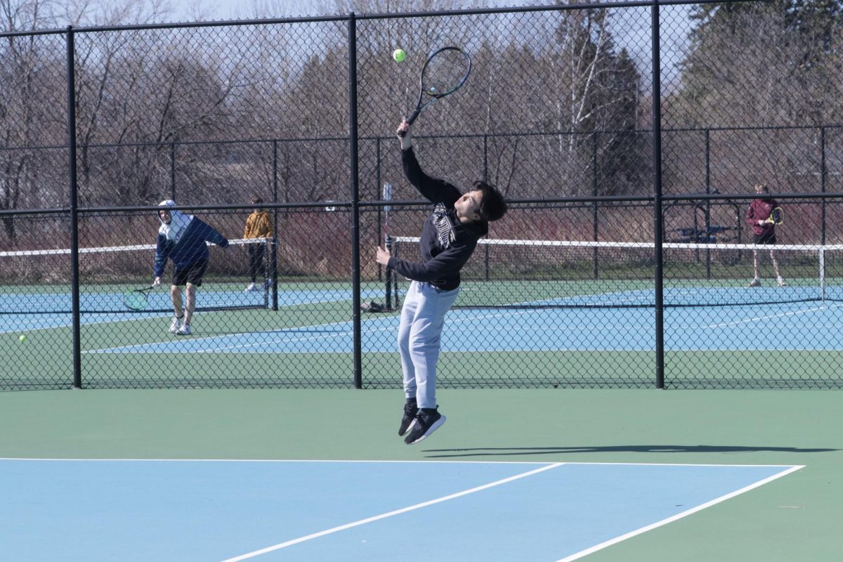 Senior Kevin Phu jumps up to hit the ball back to his competitors side at the NBC Spartan Sports Complex on April 24, 2024. 
