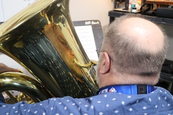 Band director Dan Eaton practices tuba in the band room on May 1, 2024. Eaton finds time to practice in the corner of the room.