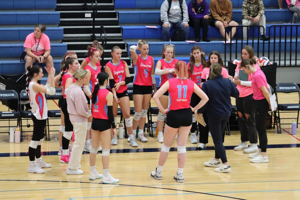 Coaches Kristen Reisgraf and Jordyn O’Brien circle up with players during a timeout on Oct. 3, 2024 in the Spartan Arena. The Cloquet Lumberjacks defeated the Spartans 0-3.
