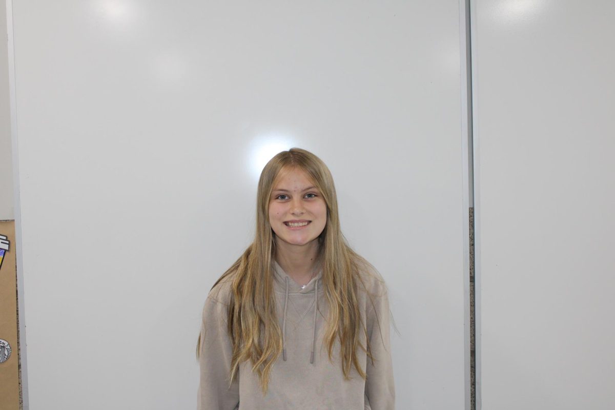 Freshman Paige Lindberg smiles for a picture in a classroom on Sept. 17,  2024.