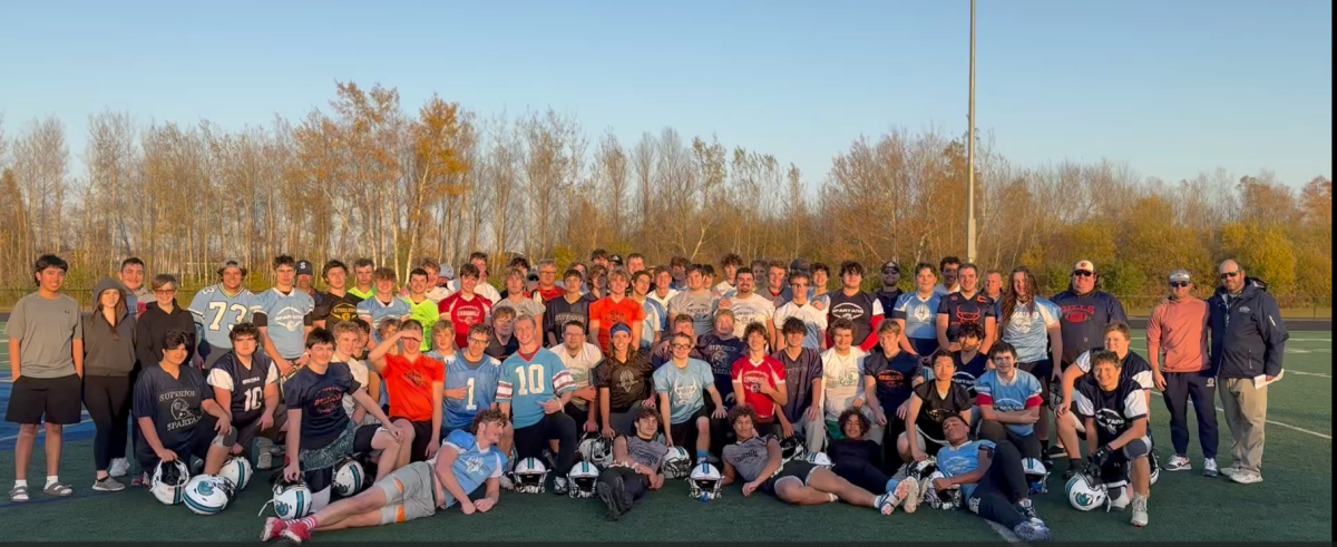 Superior High football players pose in their SYFL jerseys
