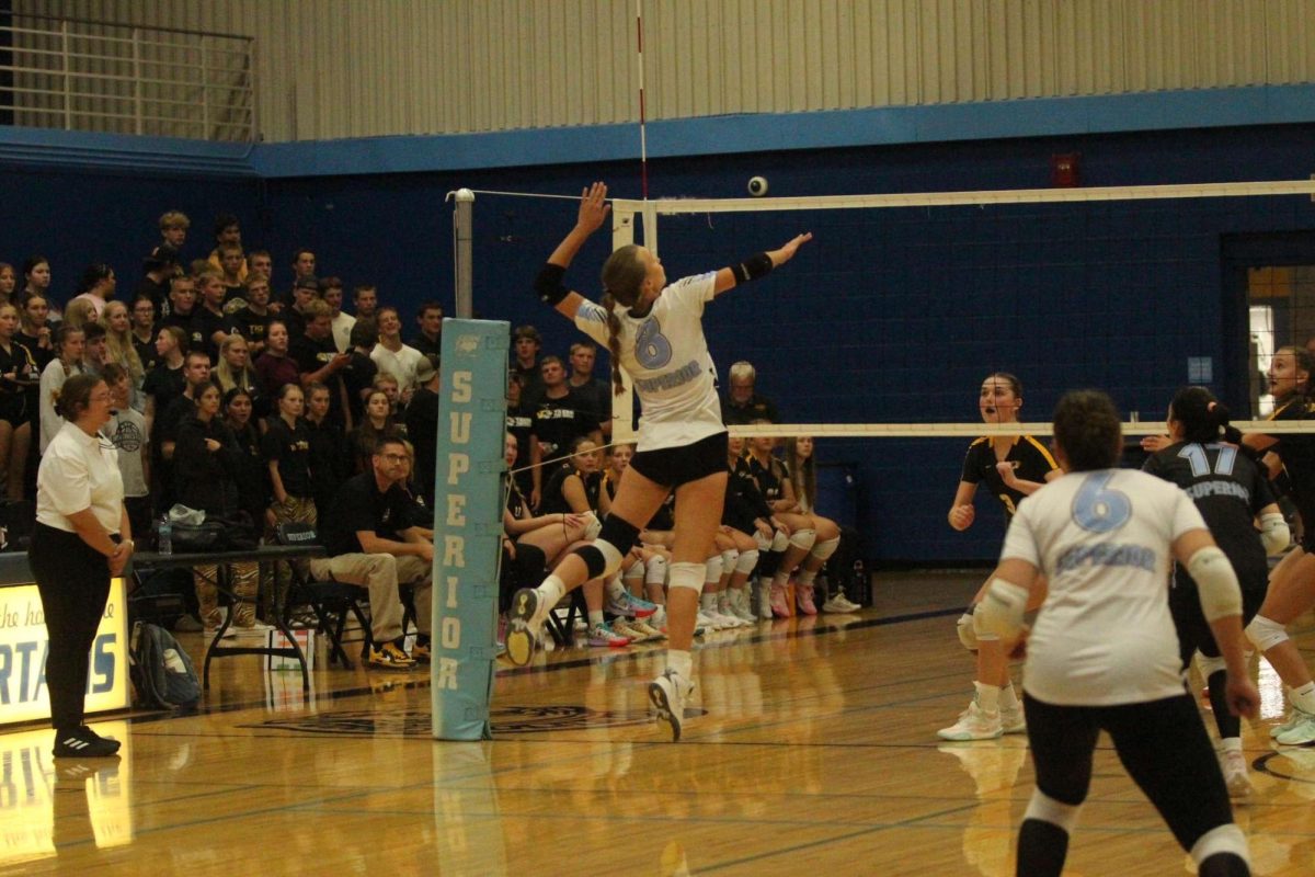 Senior captain Tarah Yliniemi jumps to spike the ball against Northwestern in the Spartan Arena Sept. 5.