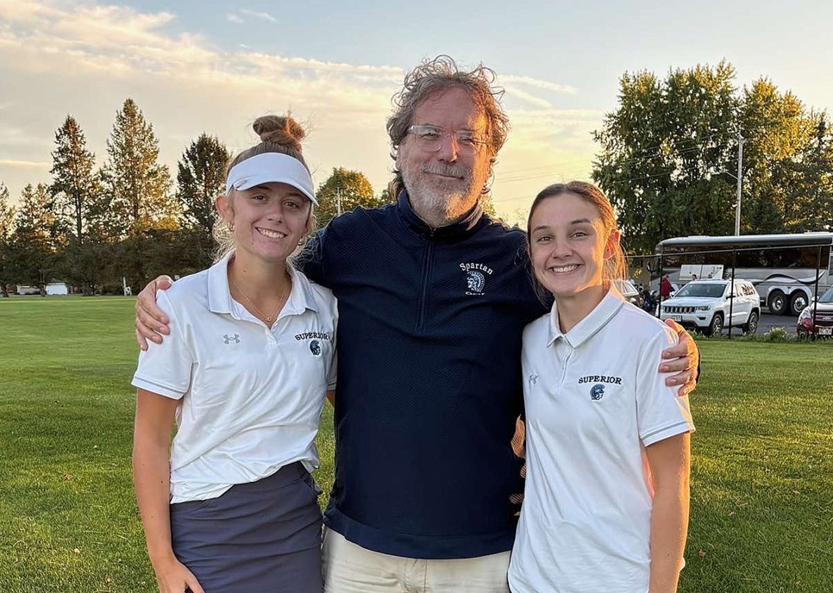 Submitted by Angela Johnson

Seniors Brynn Johnson (left) and Tara Stratton pose with head coach Ed Willie (middle) on Sept. 23 in Ladysmith after their meet.
