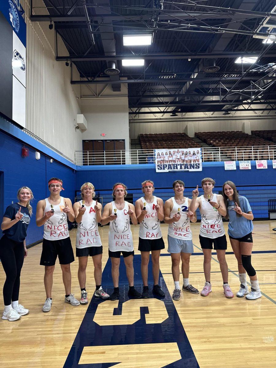 Photo by Addy Golat Senior Powderbuff team poses for a picture after winning against the junior team in the Powderpuff championship on Oct. 2 in the Spartan Arena. 
