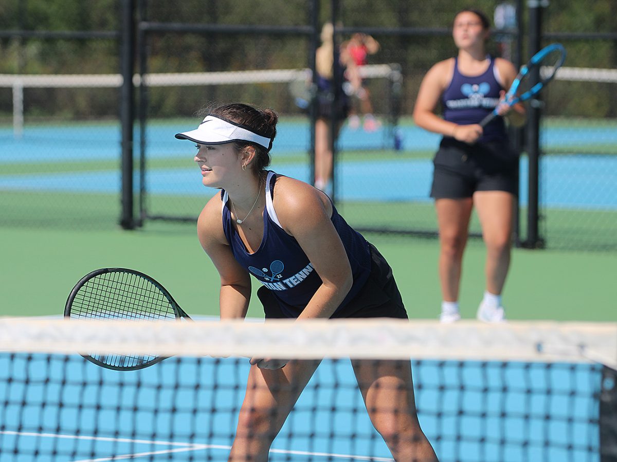 Senior Kenlyn Thimm watches her partner, sophomore, Ava Dahl’s serve go over the net during their No. 2 doubles team match against Chippewa Falls on Sept. 9. 