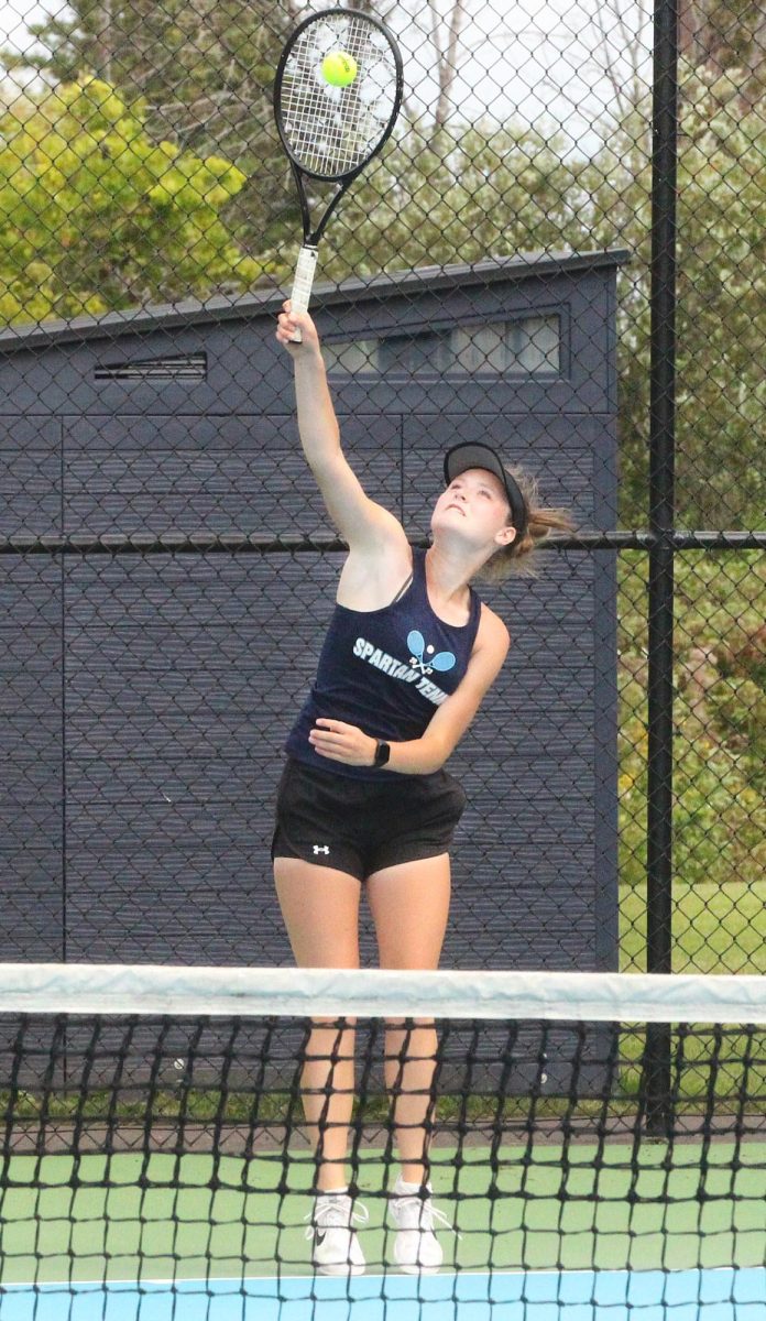 Senior Greta Clark serves during her No.1 singles match against Rice Lake at the NBC Spartan Sports Complex on Thursday, Aug. 22.