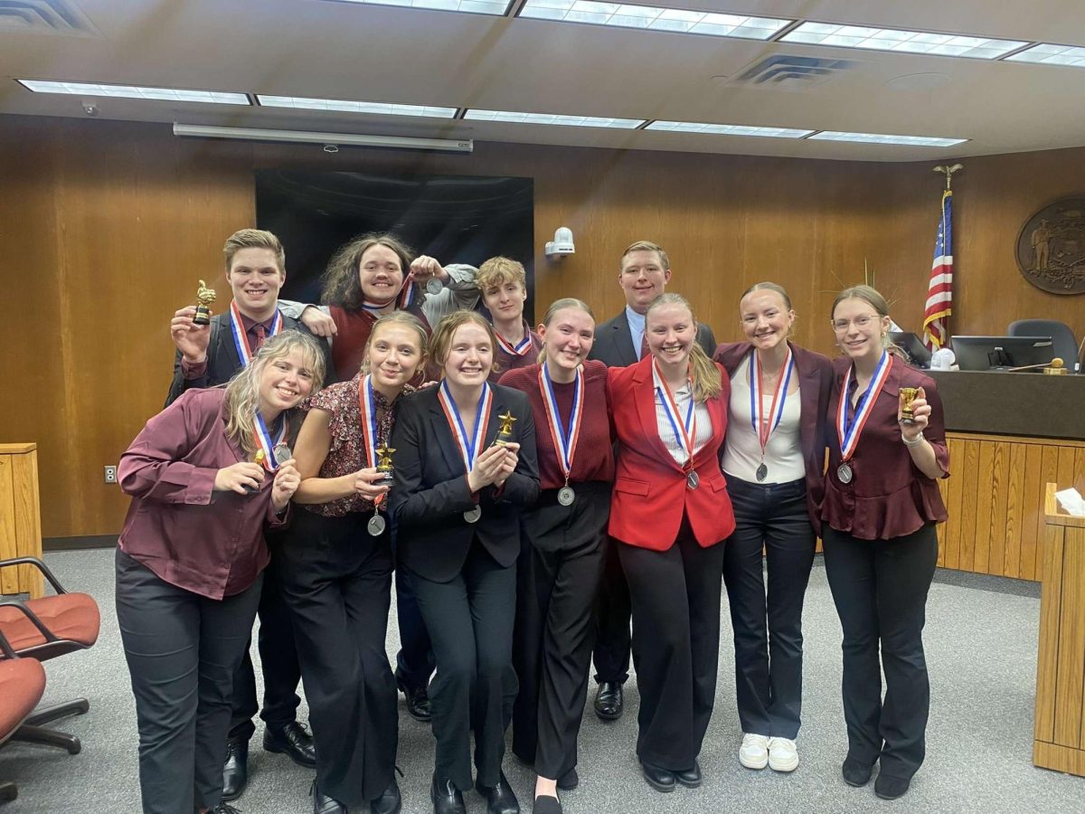 Mock trial varsity team poses for a picture after getting second place at regionals. 
