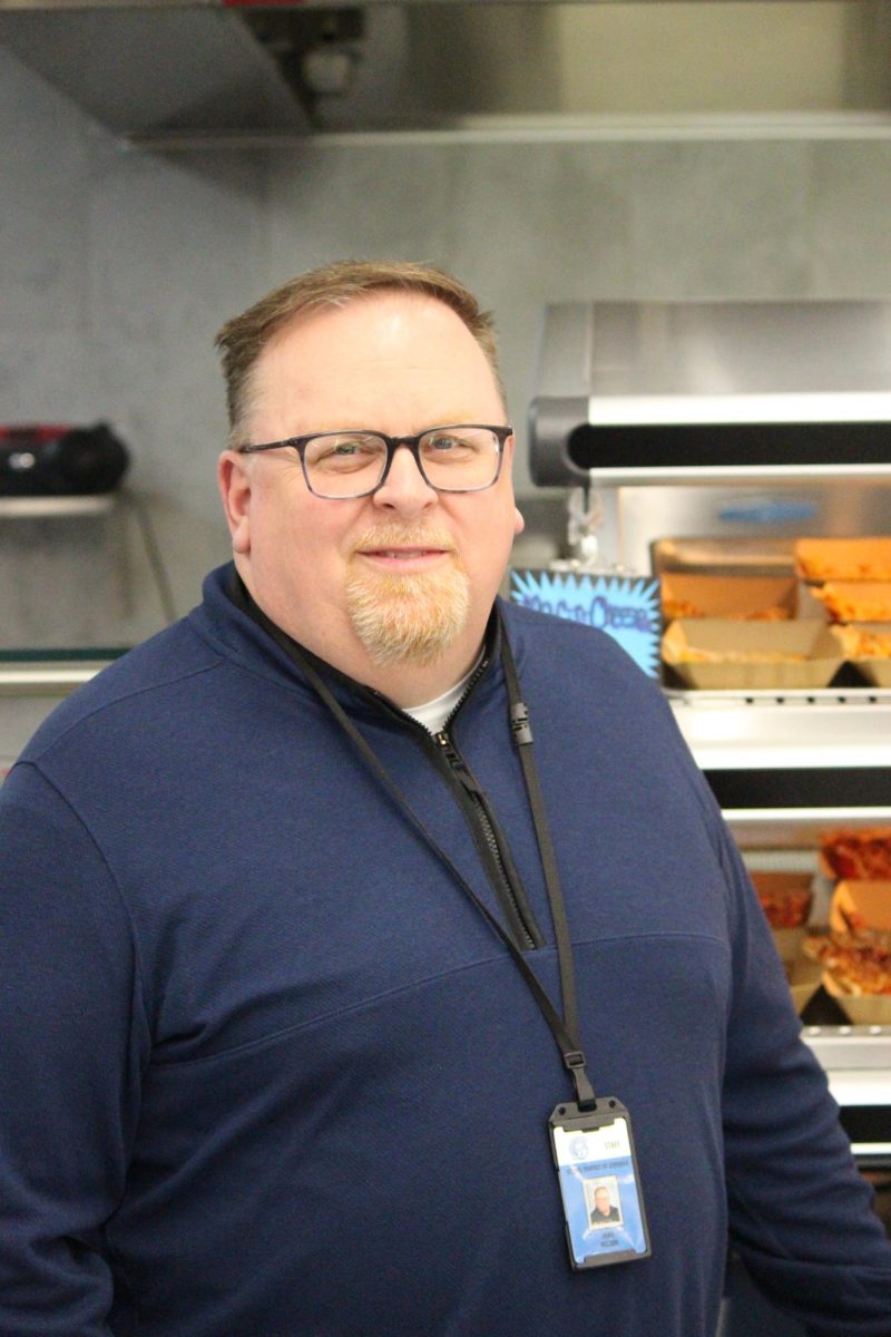 Director of Food Services Jamie Wilson stands next to his favorite pizza on Feb. 11.
