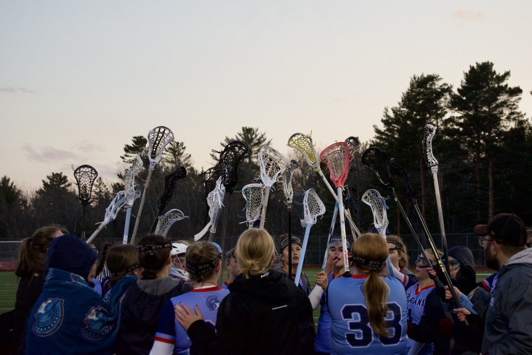 Superior high school girls lacrosse huddles before game against Wolfpack on April 22. This is the varsity girls' fourth game of the 2025 season.