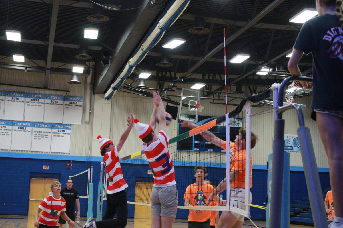 Seniors Sam Hubbard and Austin Edwards block a spike from Senior Beckett Selden in the championship set of PowderBuff. PowderBuff was held in the Spartan Arena on Sept. 24, 2025.