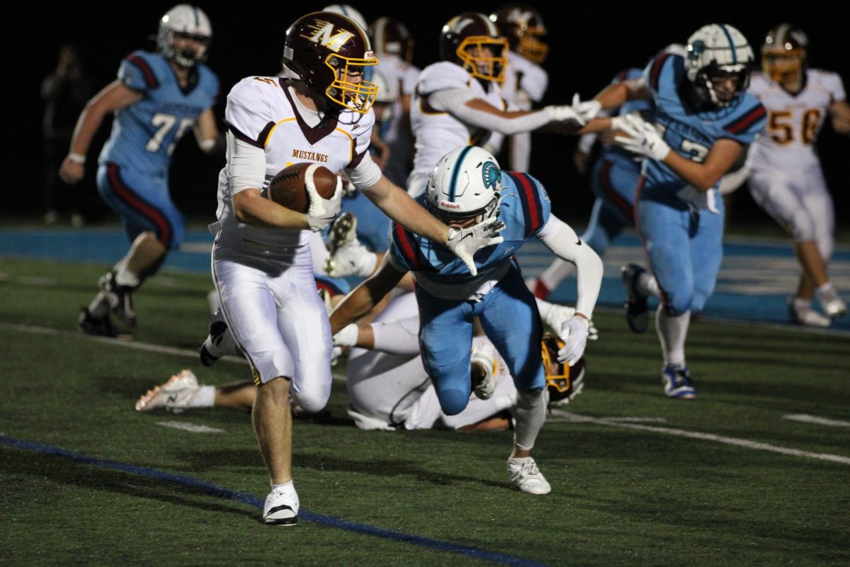 Wide receiver Liam Flores makes a tackle attempt to Menomonie ball carrier. 