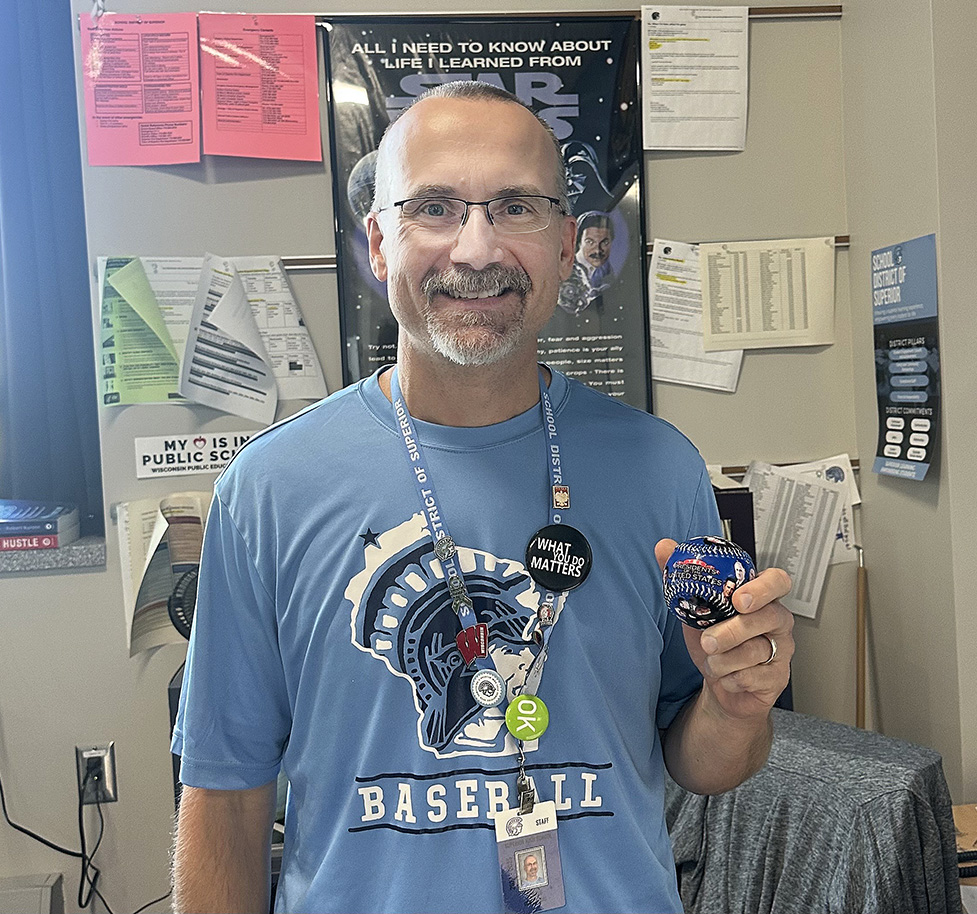 Social studies teacher Donald Dembroski holds baseball with past U.S. Presidents pictured on it on Friday, Oct. 3, 2025. 