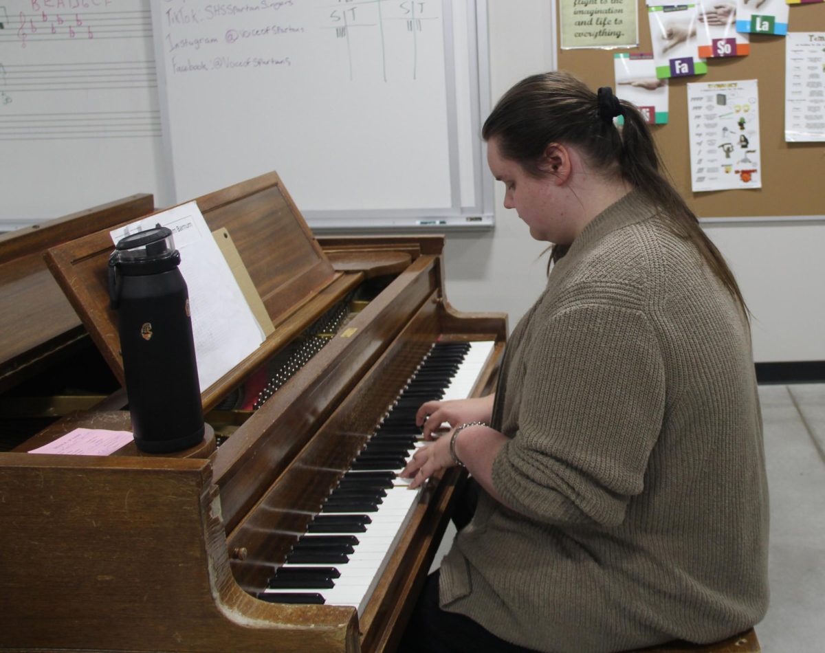 Senior Zakk Holmquist plays the piano as he leads Spartan Singers warm ups on Sept. 18 2025. Holmquist has been a Spartan Singers since the middle of his freshman year.