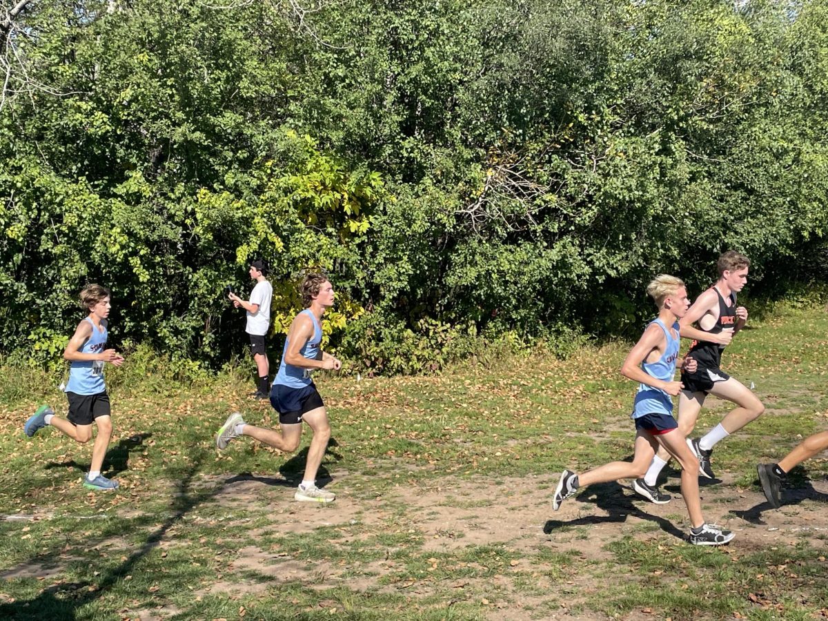 Captain Max Carrey runs up the hill again for the second time at Enger Golf Course during the Swain Invitational on Oct. 4.