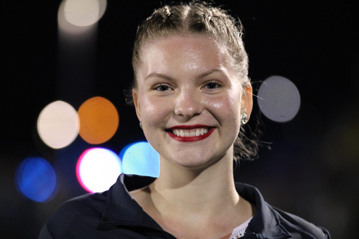 Freshman Mckellan Caudell prepares for the homecoming game performance with her team on Sept. 26. This was her first performance with the Spartan Twirlers this season. 