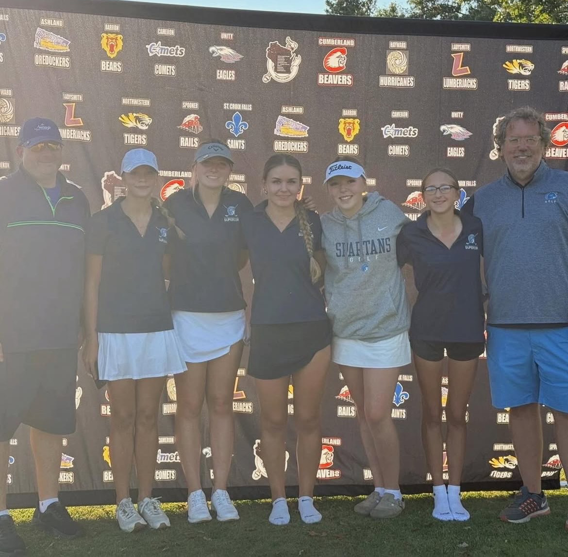The girls golf team poses with coaches Ed Willie and Rob Pierce on Sept. 24. They achieved an overall tie for third place for the season, placing fourth in the meet. 