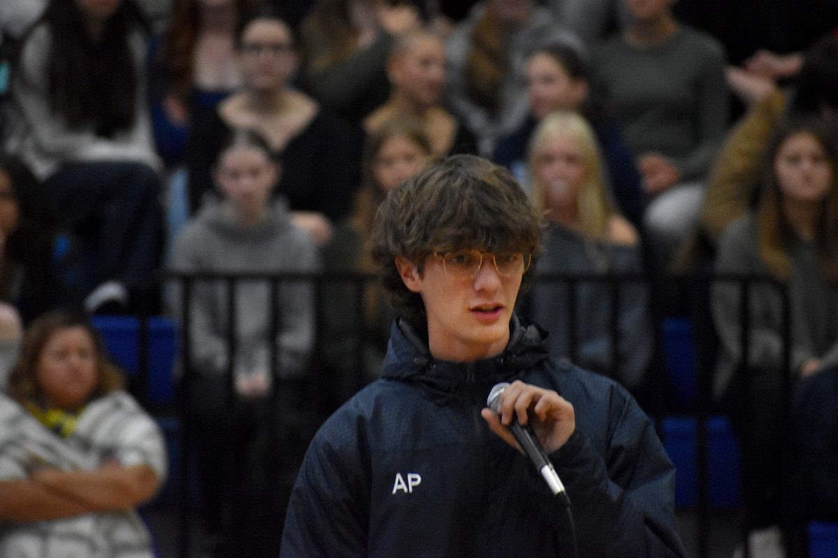 Junior Aiden Pagnucci stares at the crowd during speech at homecoming kick-off assembly on Sept. 19.
