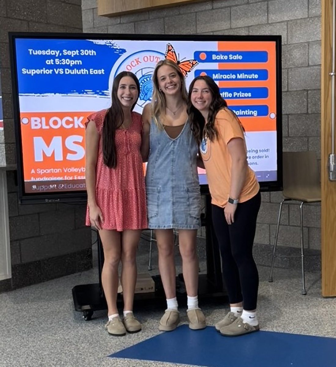 Seniors Brekyn Warburton (left), Claire Egnash (middle), and Kate Porter (right) pose for a picture before the game on Sept. 30, 2025.
