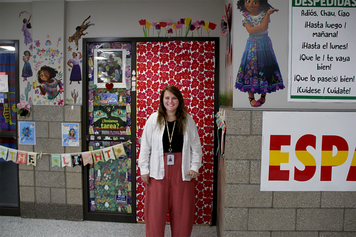Spanish teacher Samantha Wizorek poses in front of her classroom door on Sept 30.