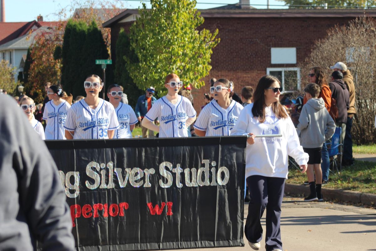 Sterling Silver Studios strut their way down 21st Street to join in the Spooktacular on Oct. 25.