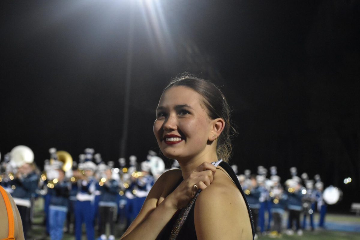  Junior Nevaeh Utyro looks at the crowd of people as she is preparing to perform at her last halftime performance of her junior year on Oct. 11 2025.
