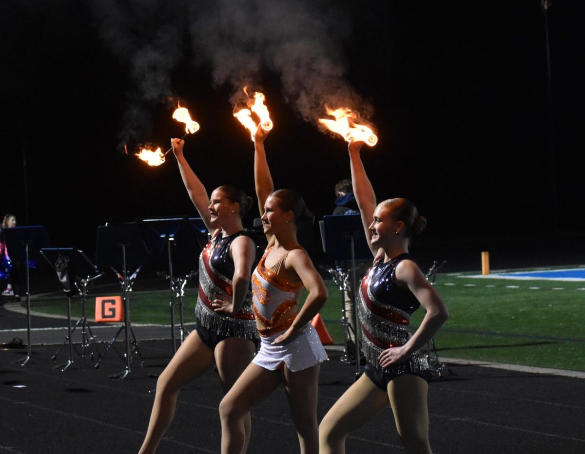  Fire Twirlers finish their halftime performance on Oct. 10.
