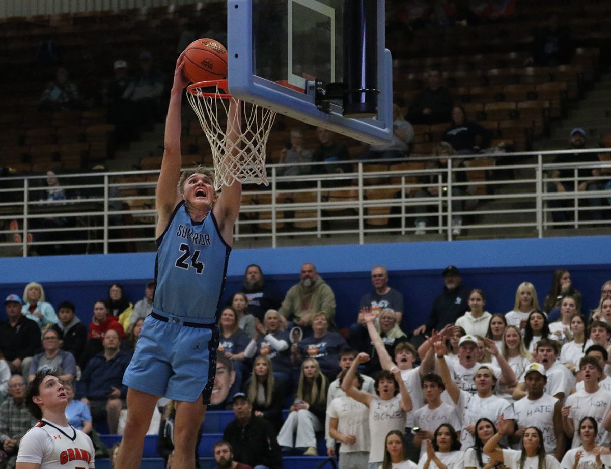 Senior forward Calvin Anderson ascends towards the hoop as he goes up for a dunk during the second half of the game against Grand Rapids on Dec. 2.