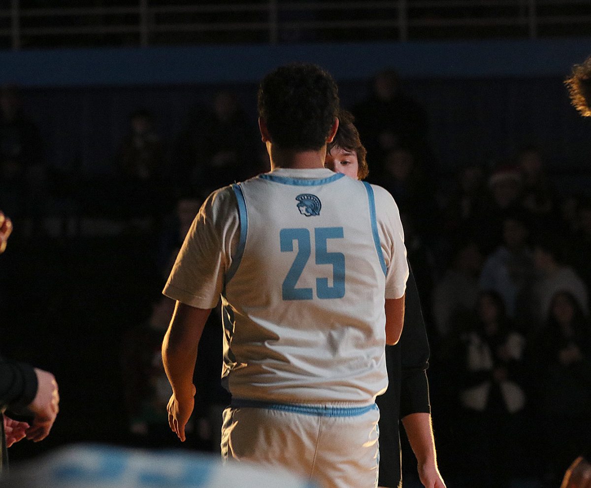 Senior Kaden Covill runs up after being announced for his first career start on Dec. 20.