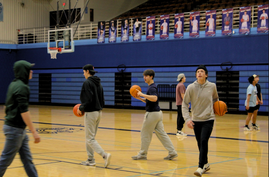 (Left) Owen Taylor, (Left center) Tucker Tepsa, (Right Center) Wyatt Wells, (Right) Thor Netland. Students in Mrs. Soderstrom's 4th hour gym class celebrate finished summatives for the semester with a free day of basketball.