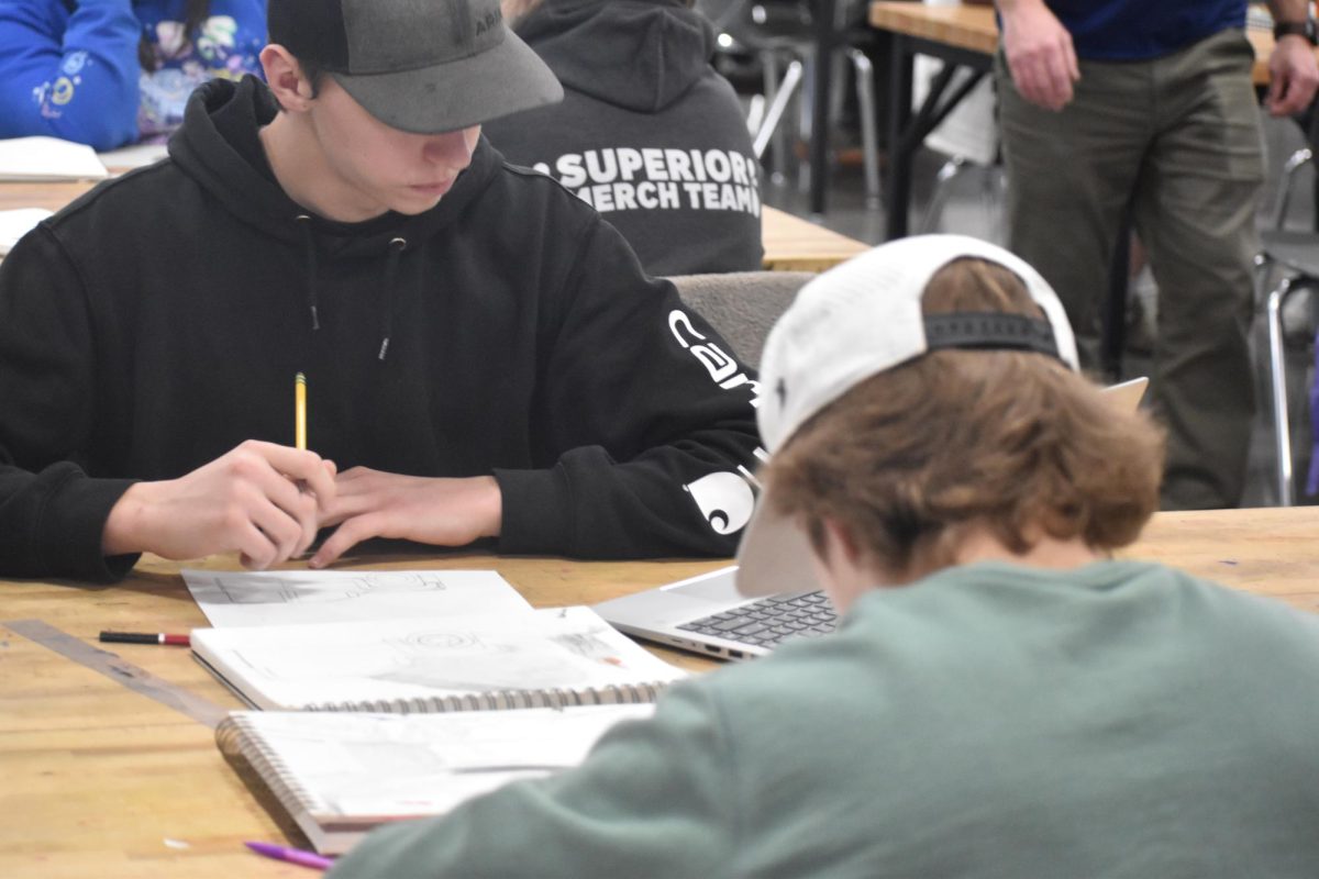 Juniors Calab Trader and Versii Kavajec do their final summative free choice art project in Mr Moon's class on Jan 1/12.

