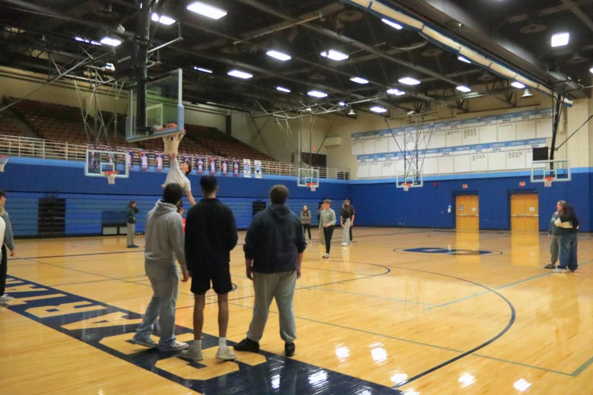 Gym students in Krista Soderstrom’s 5th hour lifetime fitness gym class play basketball as their activity for the day on Jan 6.