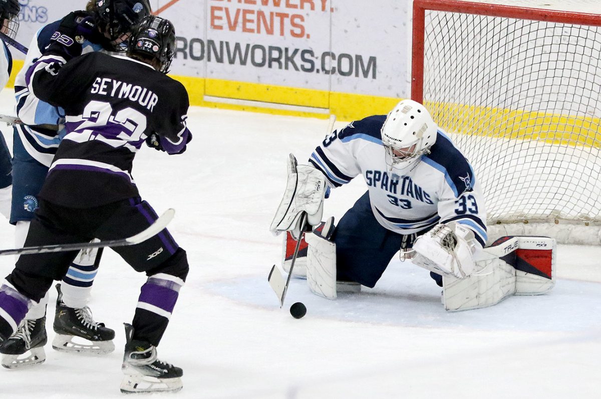 Senior goaltender Ryan Pettingill dives towards the puck in the third period on Jan. 3. 