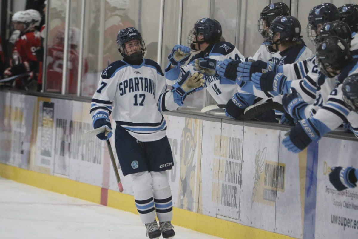 Freshman Ryan Nelson (#17) skates through the lineup after scoring in a game against Northern Lakes on Dec. 4 2025.  