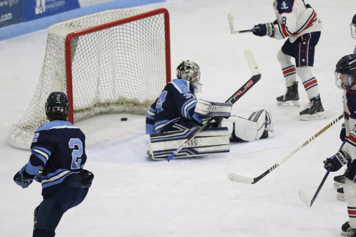 Senior Hunter Sidorowicz falls as Hibbing scores their third goal of the first period on Jan. 29.
