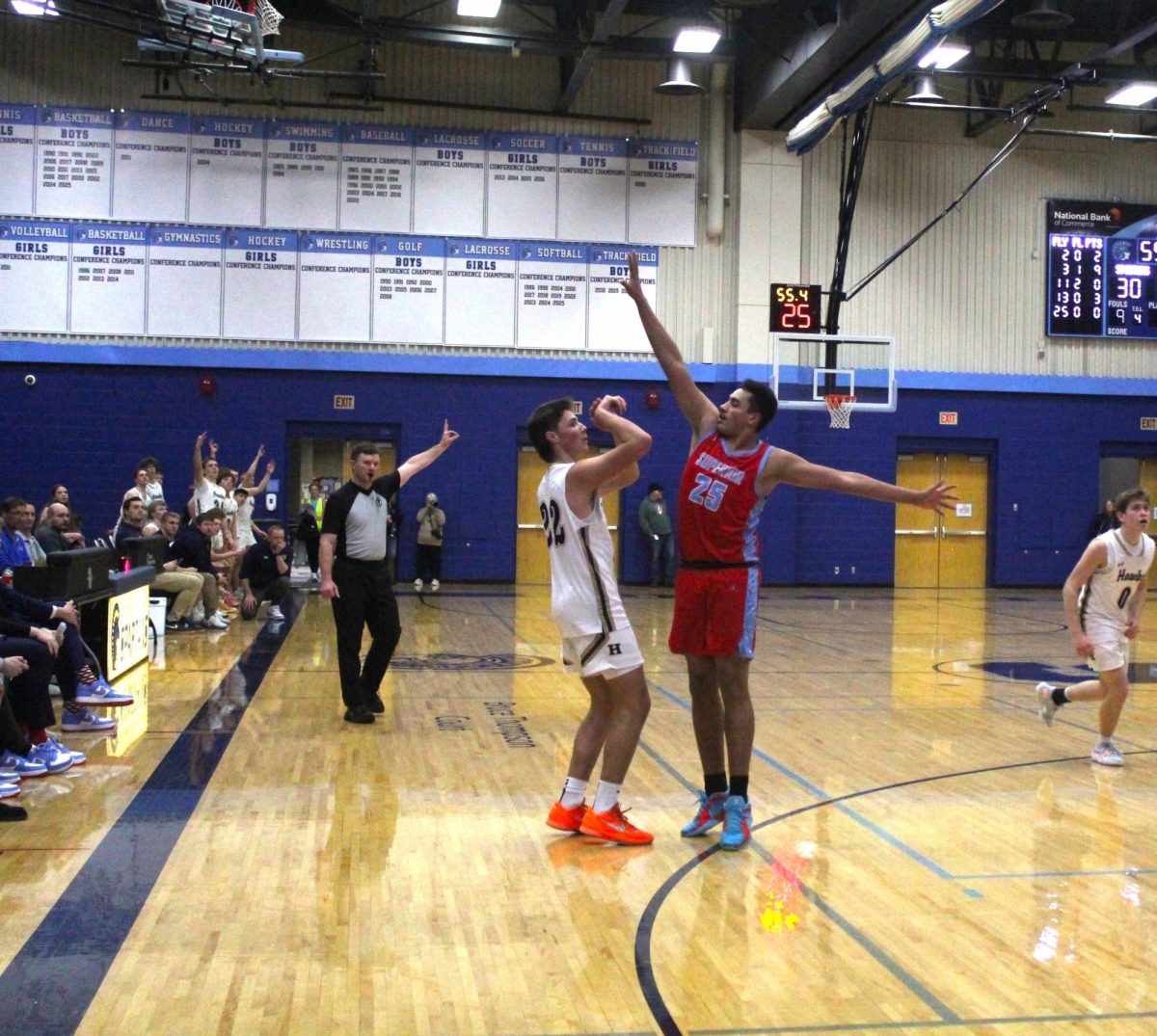 Senior Kaden Covill blocks a shot from Hermantown player on Feb. 20 in the Spartan Arena. 