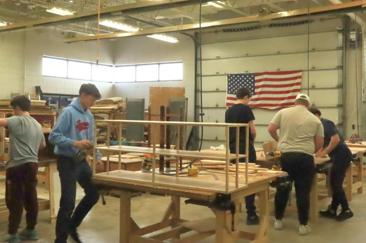  Students in Pete James’s Tech Ed class on Jan. 12 working hard in the shop. At the same time, students worked on finishing up assignments on their laptops. This class will also be switching at the end of the semester. 