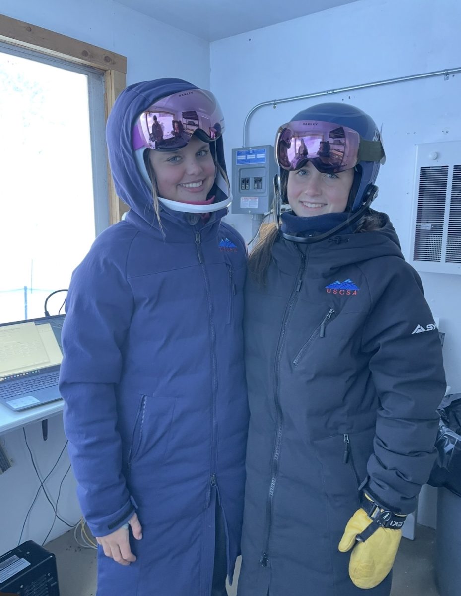 Freshman Allison Mihalik and Senior Olivia Mihalik (left to right) standing next to each other in the start shack.