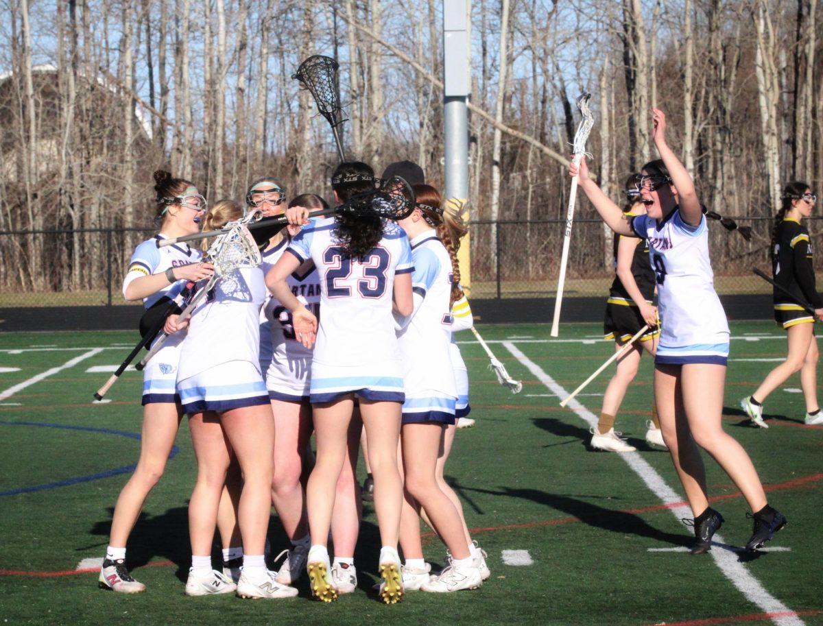 Superior girls lacrosse team jumps with excitement after their first regular season lacrosse game on Apr. 16.