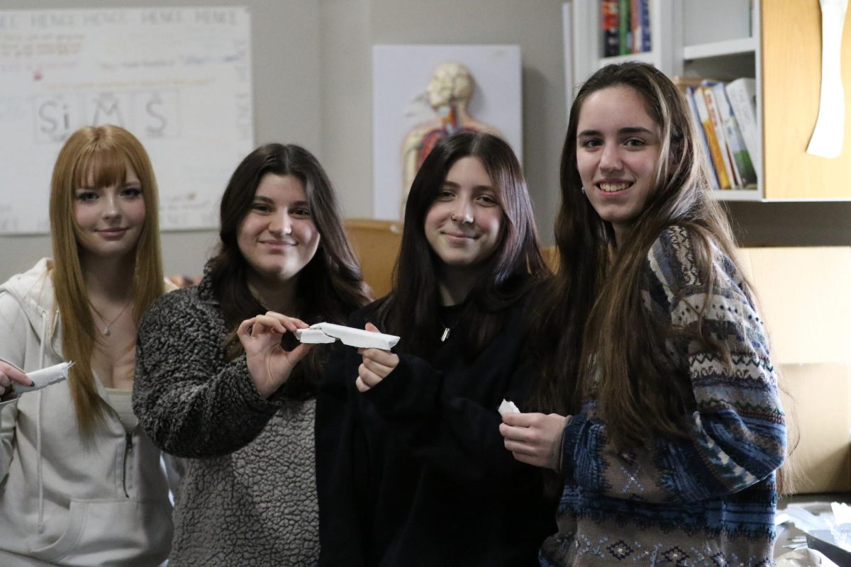  Kynzie Popelka (left), Savannah Startling, Storm Heffelfinger, and Amber Smith (right) hold their bones after finding out their bones withstood the most amount of weight Feb.12
