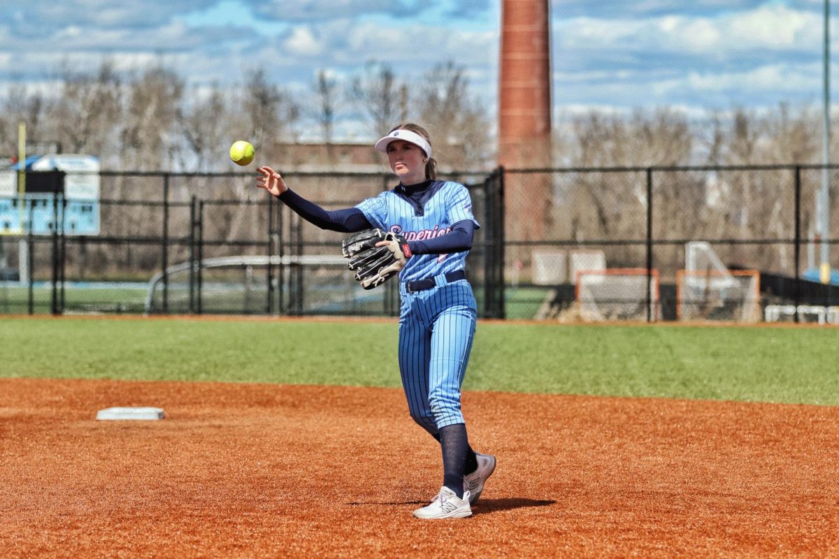 Freshman second baseman Lexi Checketts throws the ball to first base after fielding a groundball during their game against the Hawks from Hermantown on April 28, 2026.
