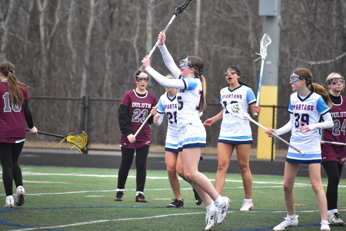 Freshman midfielder Karina Ivy-Green and teammates celebrate after scoring during the JV game on April 14.