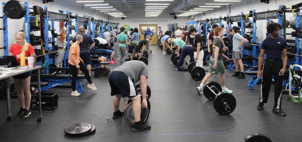 The Spartan Athletic Development group sets up for their lifts on Feb. 13.
