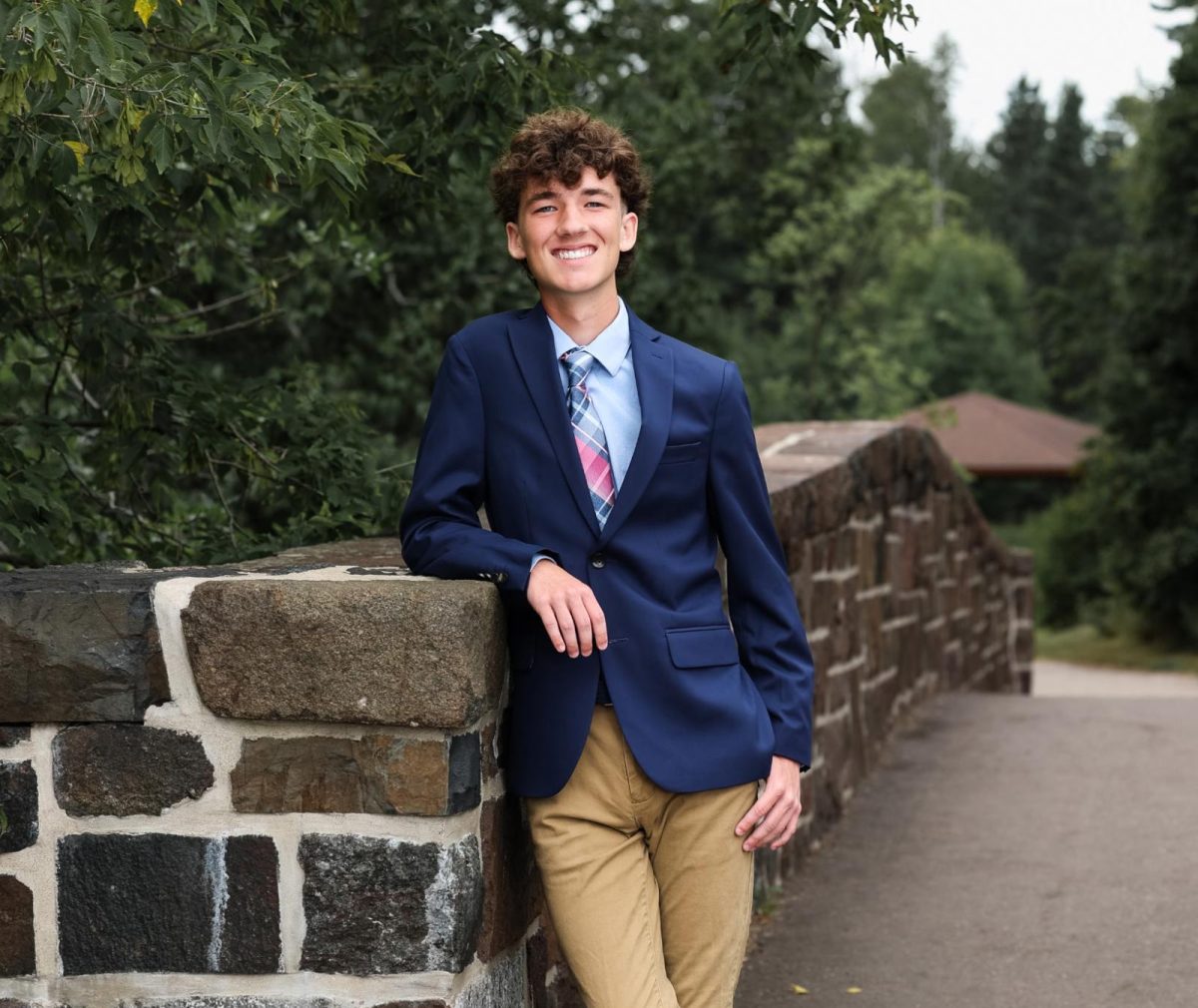 Senior Kegan Sumption posing for his senior photo