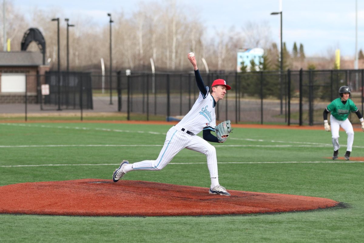 Senior pitcher Dawson Ahlborg pitches the ball with a runner on first during the second inning of their ALS charity game against Rock Ridge on April 30, 2026. 