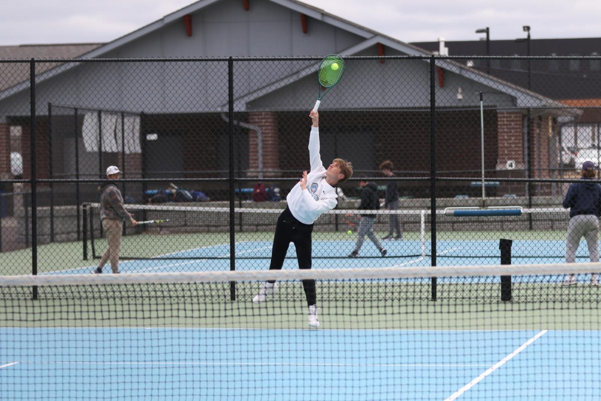 Senior Ty Soderlund hits his serve during his match against Hibbing on May 6.