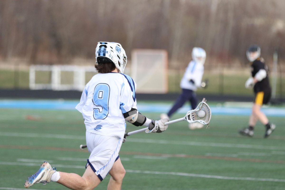 Sophomore Braden Rantala runs down the field with possession on May 4.