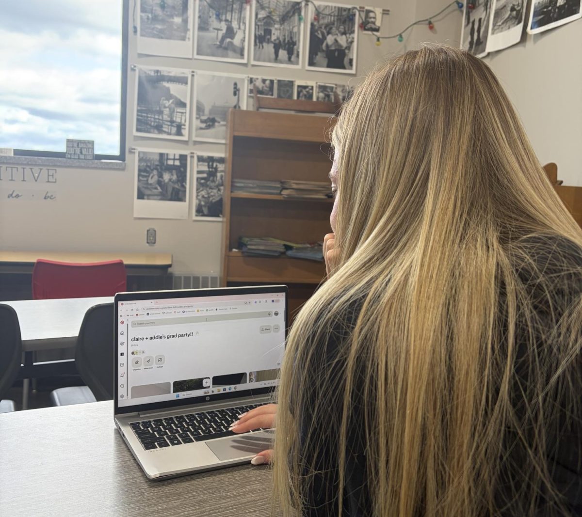 Claire Egnash looking at graduation boards
