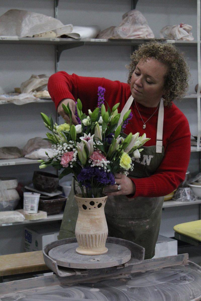  Ceramics teacher Nikkee Francisco Hayes adjusting her flowers in her pottery